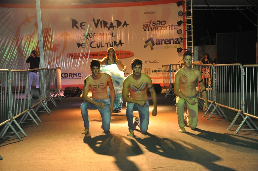 In this image there are three boys kneeling on the floor without the shirts. It seems like it is a...