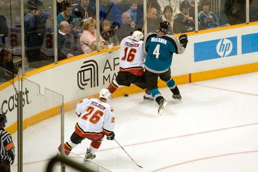 In this picture there is a man who is wearing sixteen number jersey, helmet, short and shoe. Beside...