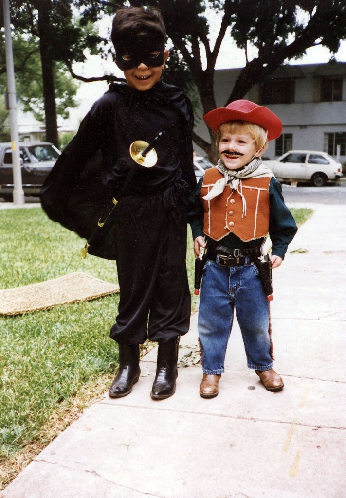 In this image we can see children wearing different costumes and standing on the floor. in the...