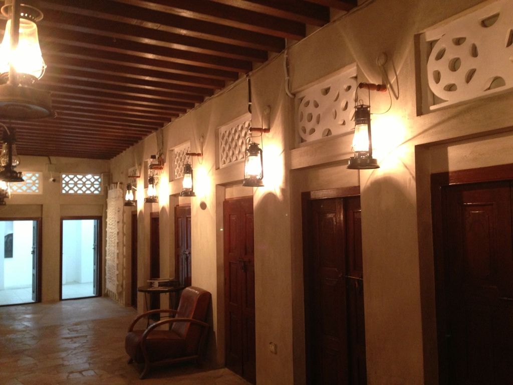 In this image we can see some rooms which were closed, to the each room there is lamp which is...