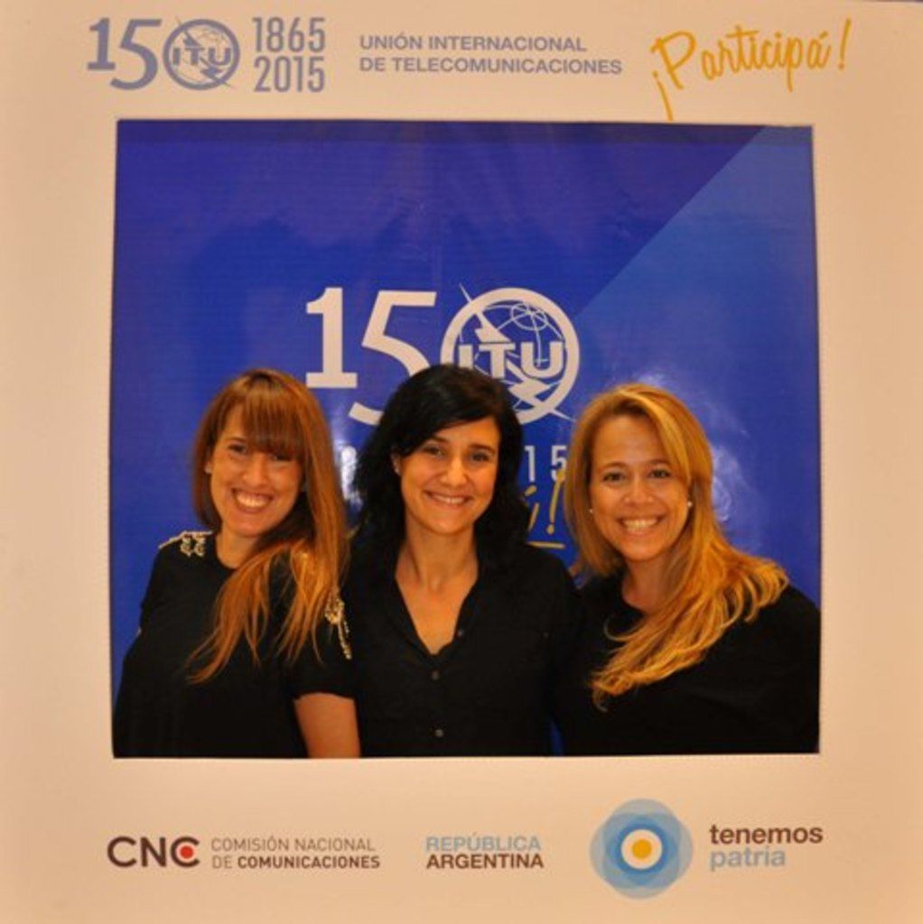 It is a photo frame of three women their background is blue color and around the photo frame there...