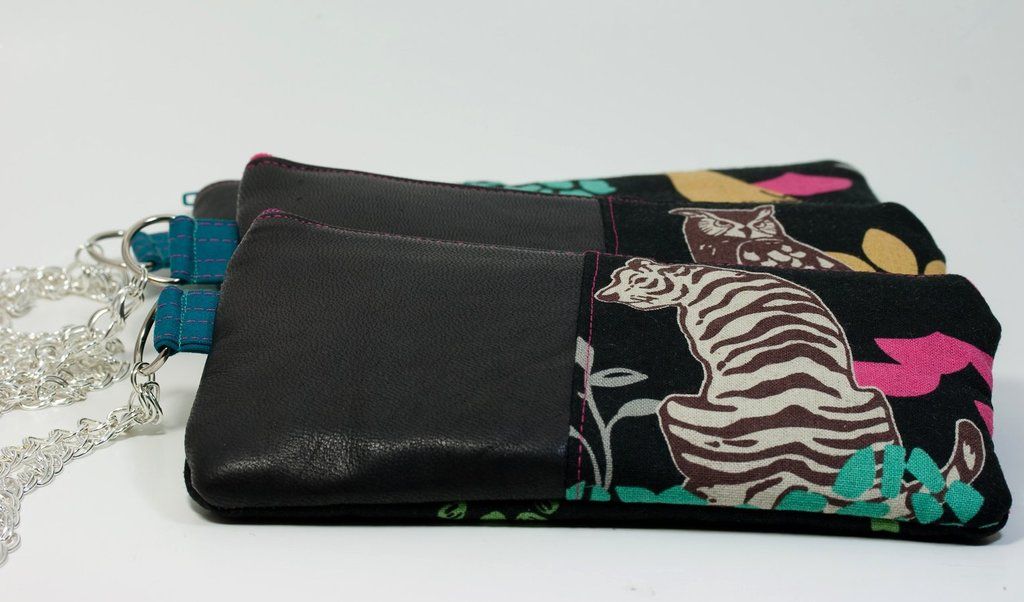 In the center of the image we can see wallets placed on the table.