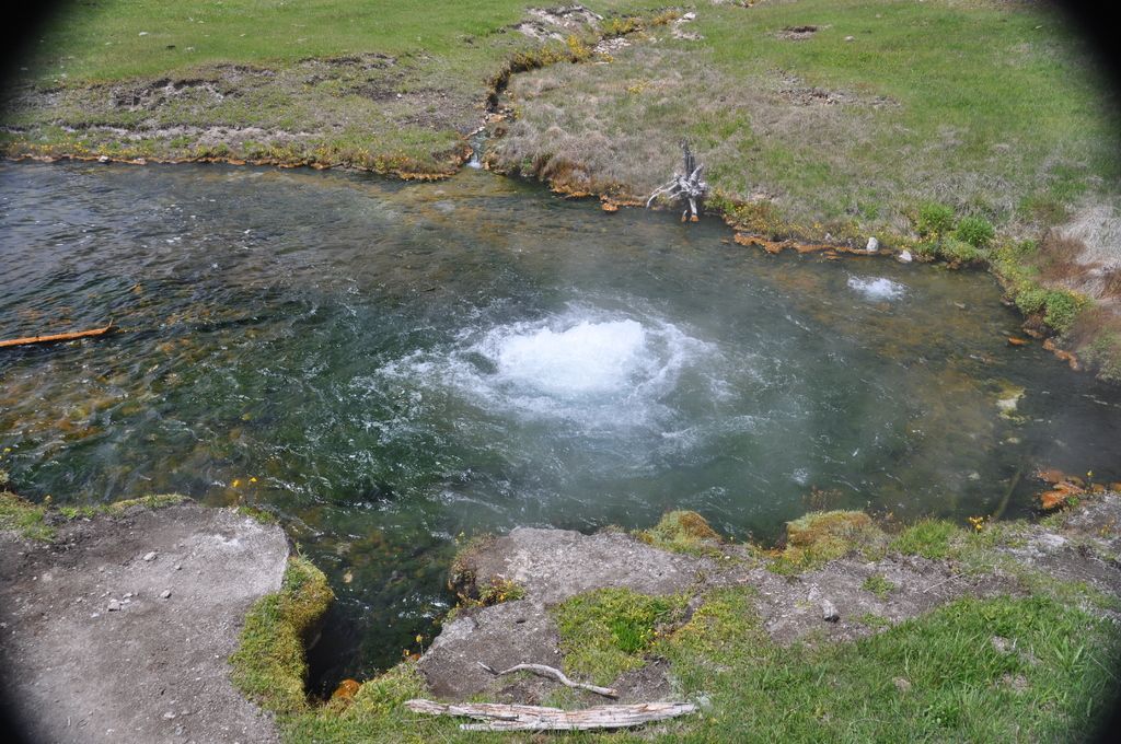 In this image in the center there is a river, and at the top and bottom of the image there is...