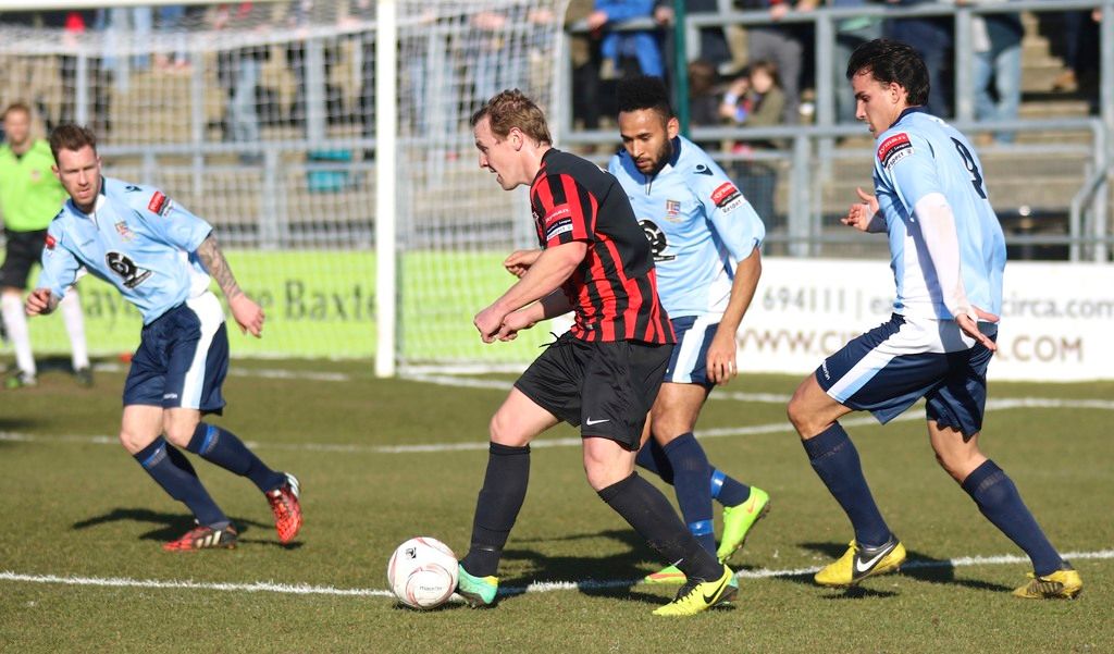 As we can see in the image there are few people playing with football.