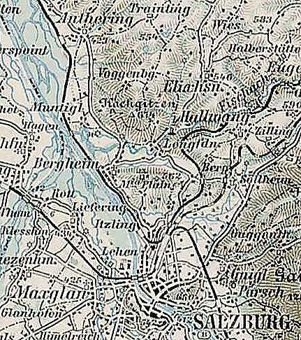 The image shows an old map of the city of Salzburg, Austria, with text written on it. The map is...