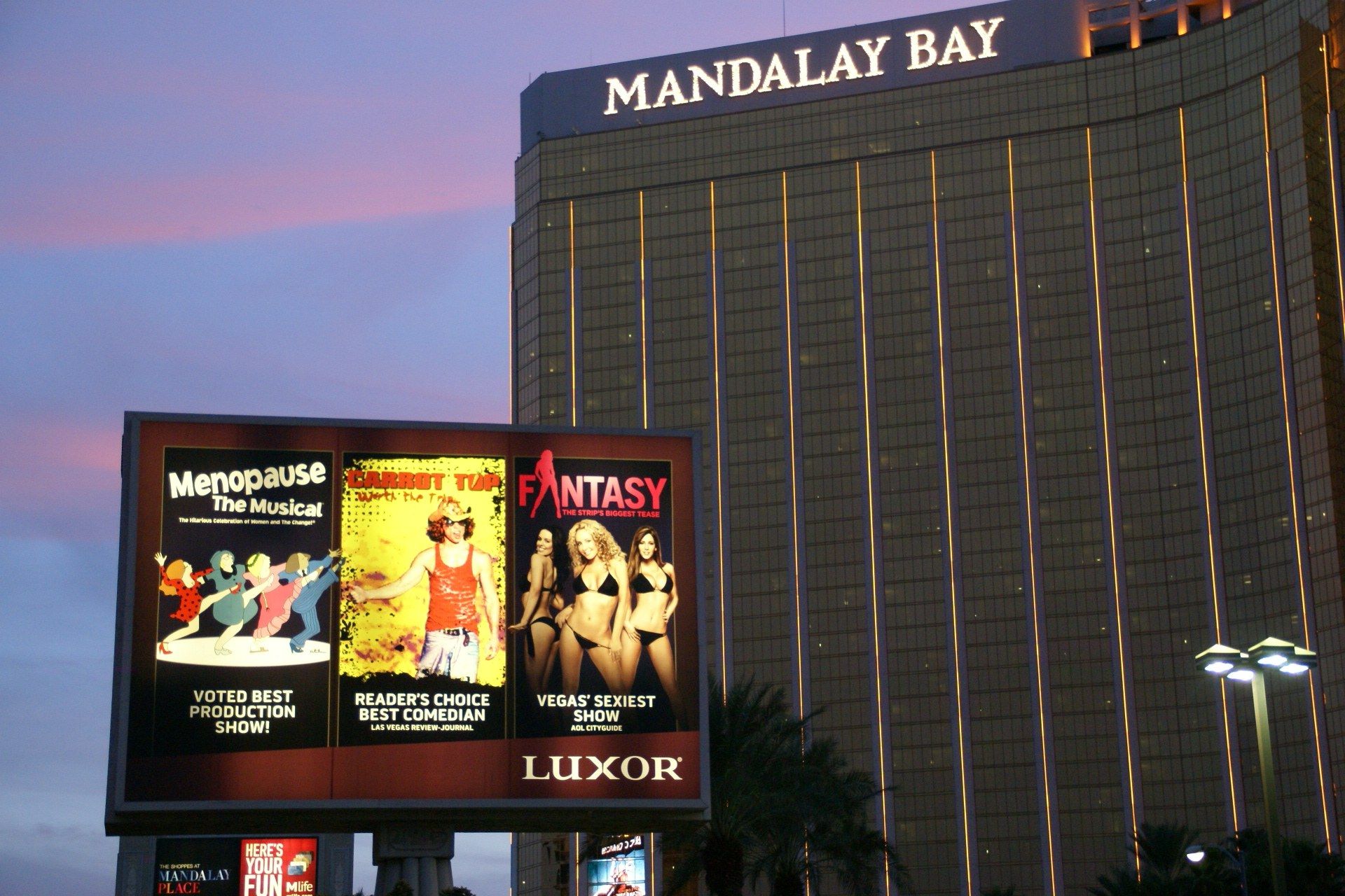 The image shows the Mandalay Bay Hotel and Casino in Las Vegas, Nevada. In the foreground, there is...