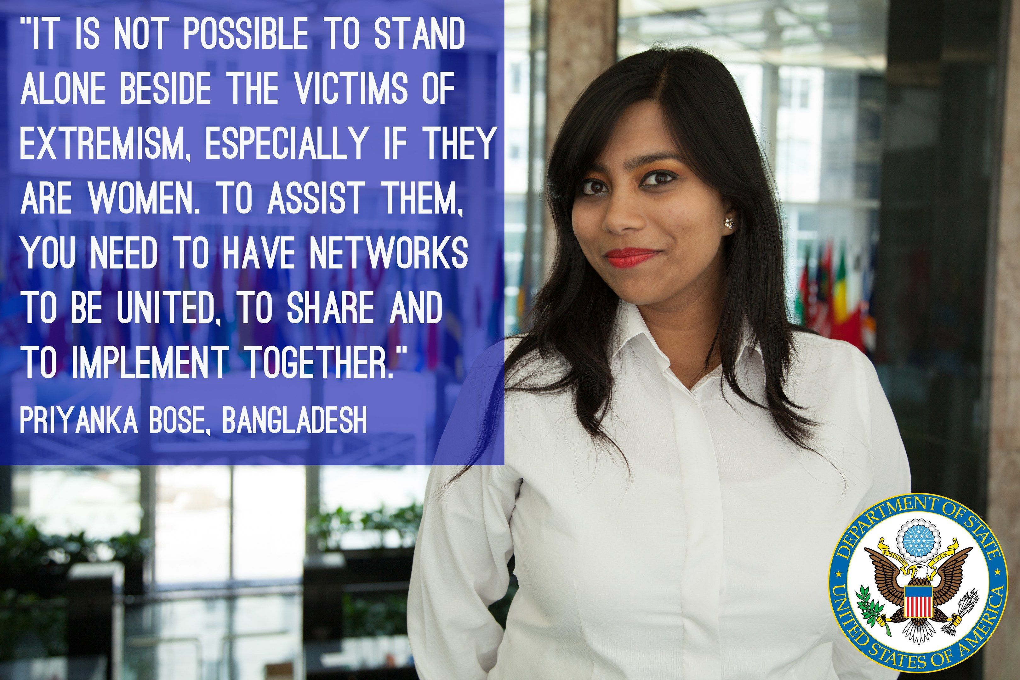 The image shows a woman standing in front of a building with a quote on it that reads, "It is not...