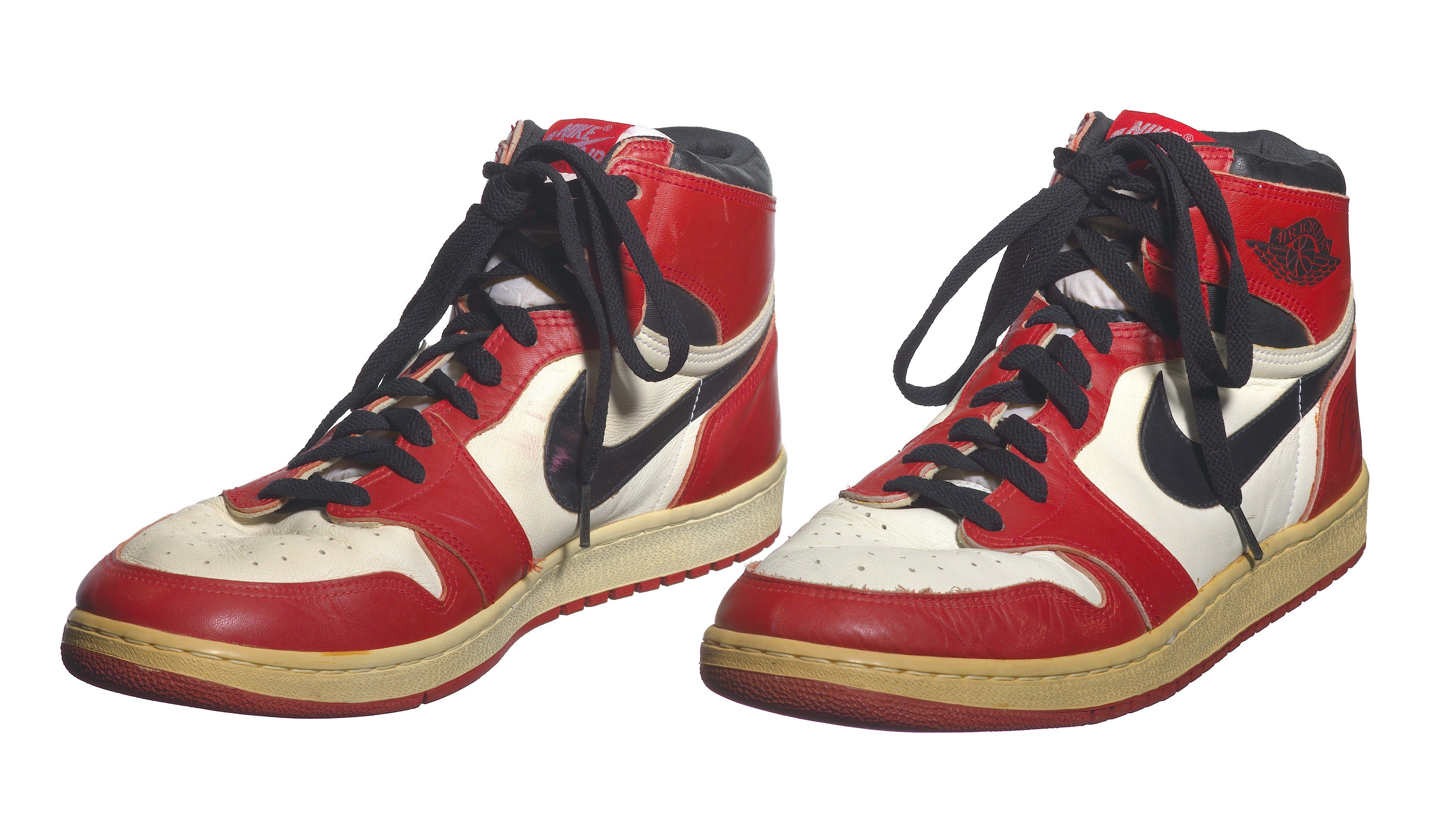 The image shows a pair of Nike Air Jordan 1 Retro High OG Bred Toe shoes against a white...