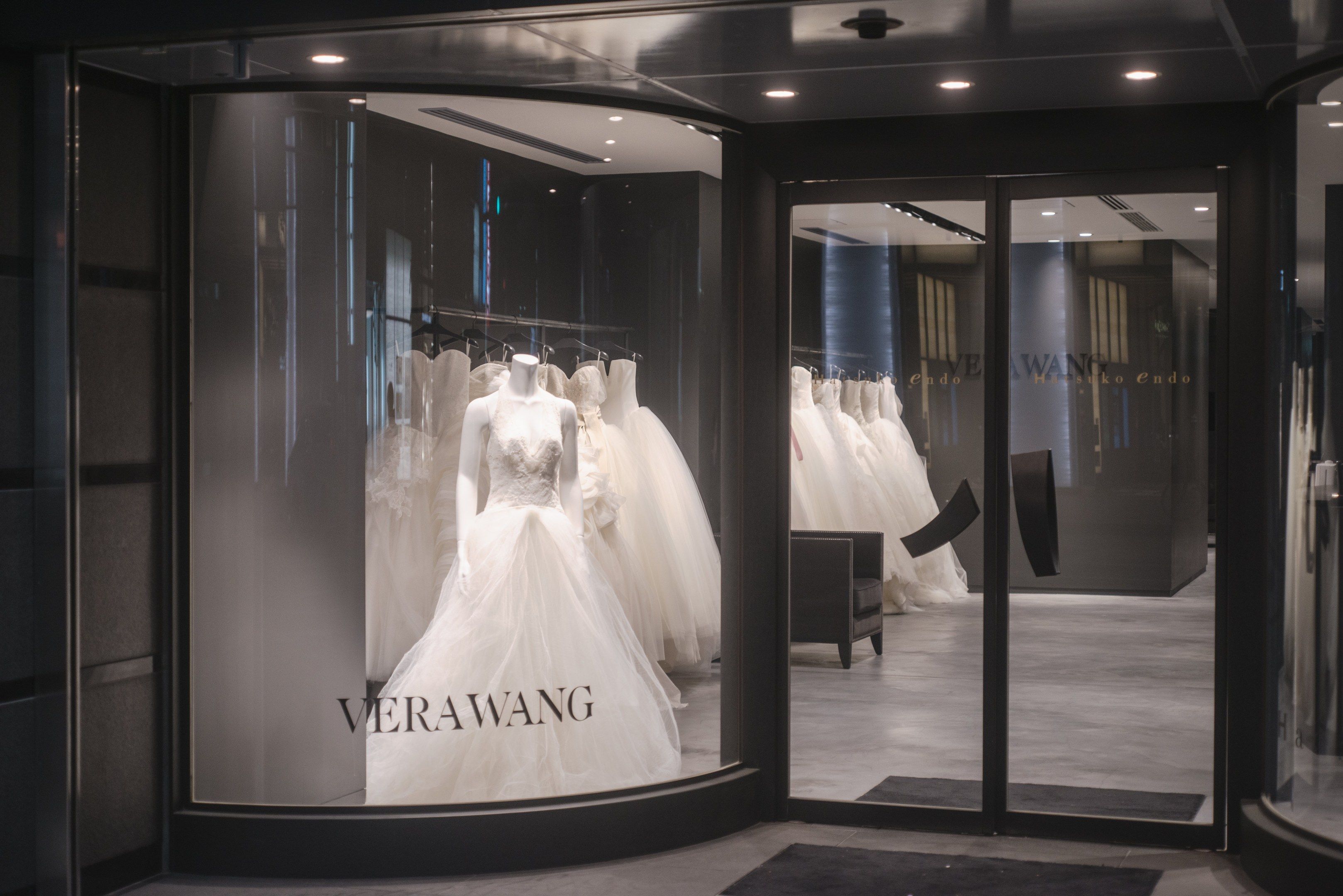 The image shows a verawang bridal boutique in Singapore, with mannequins wearing beautiful wedding...
