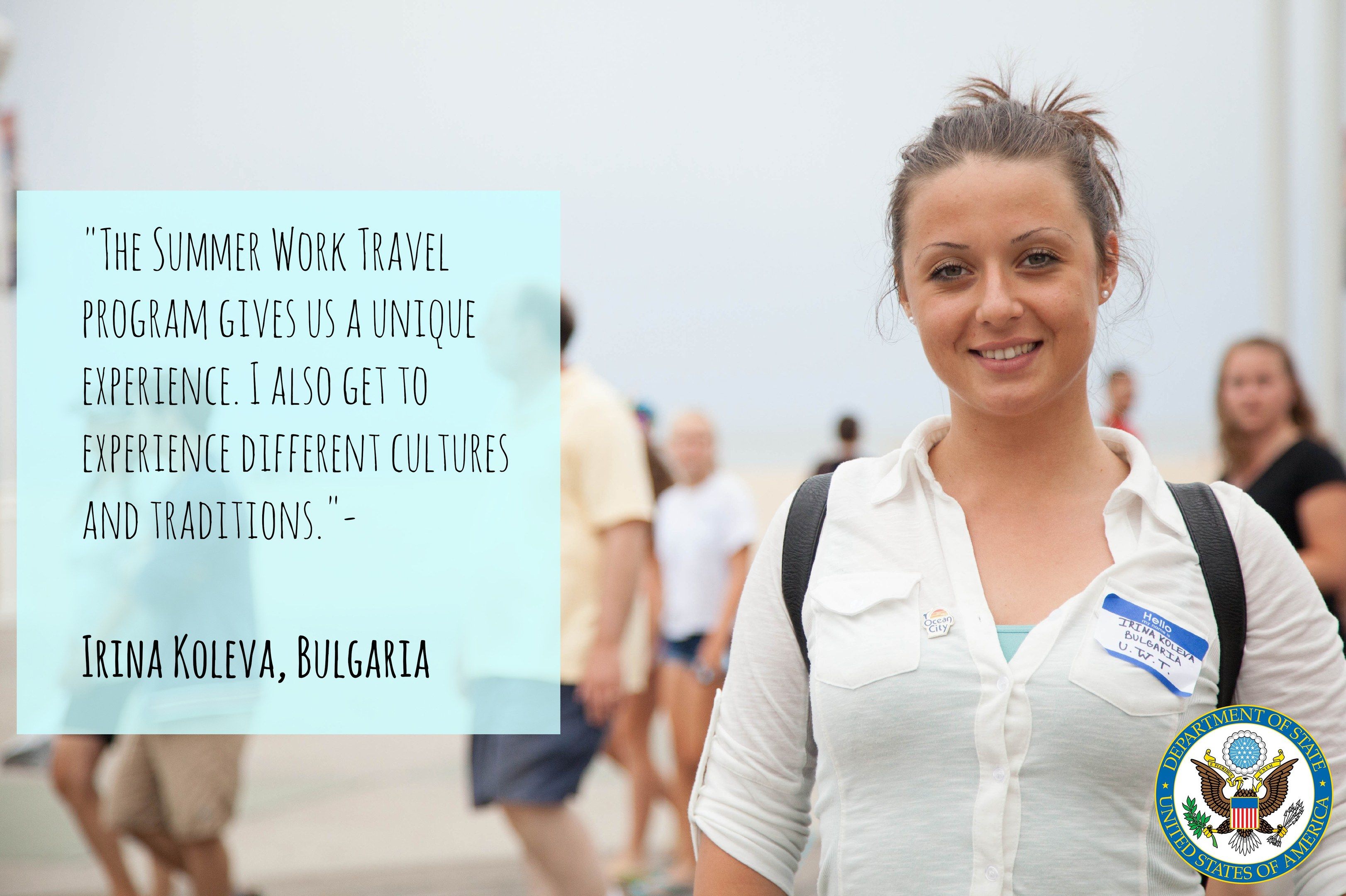 The image shows a woman wearing a bag and smiling, surrounded by a group of people walking on the...