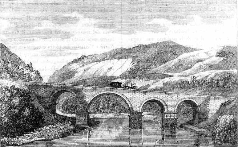 The image shows a black and white engraving of a bridge over a river with arches, surrounded by...