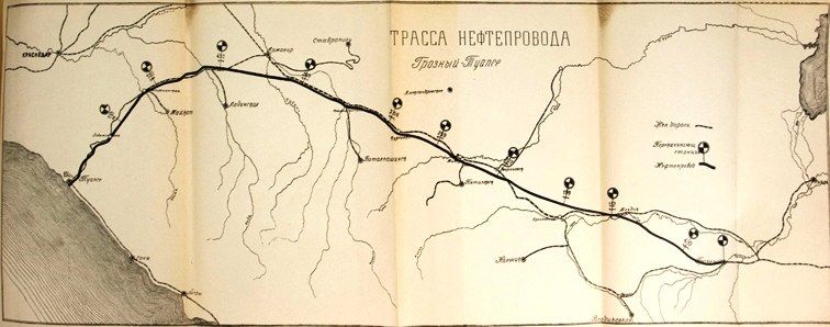 The image shows an open book with a map on it. The map is detailed and shows the various roads and...