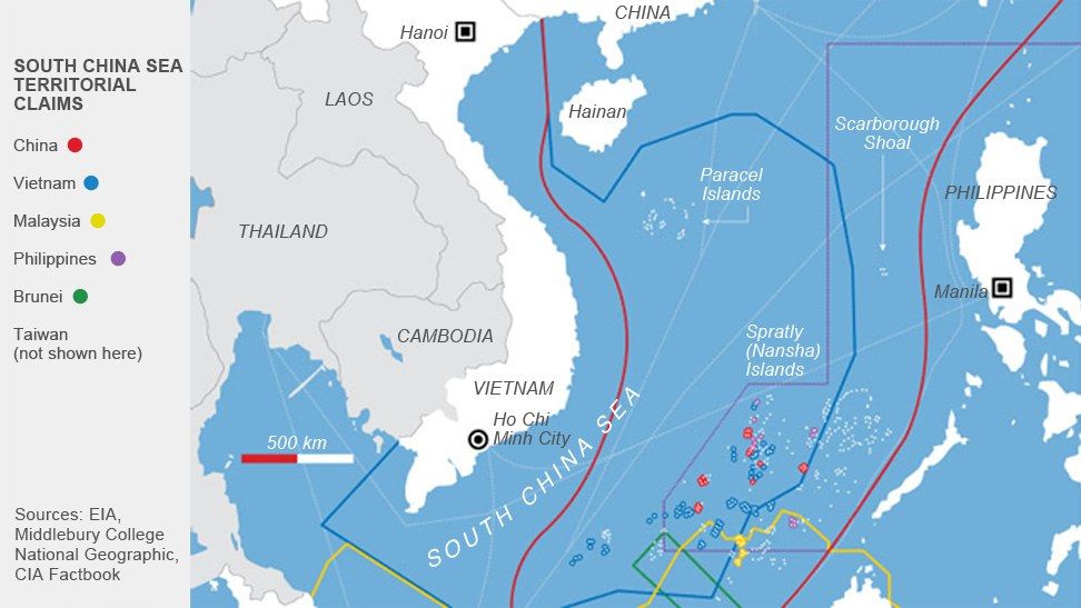 The image shows a map of the South China Sea territorial claims, with text indicating the locations...
