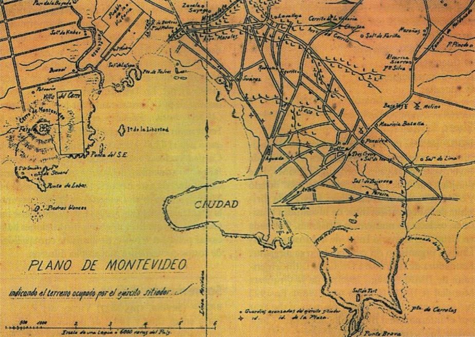 The image shows an old map of the city of Montevideo, Uruguay, with text written on it. The map is...