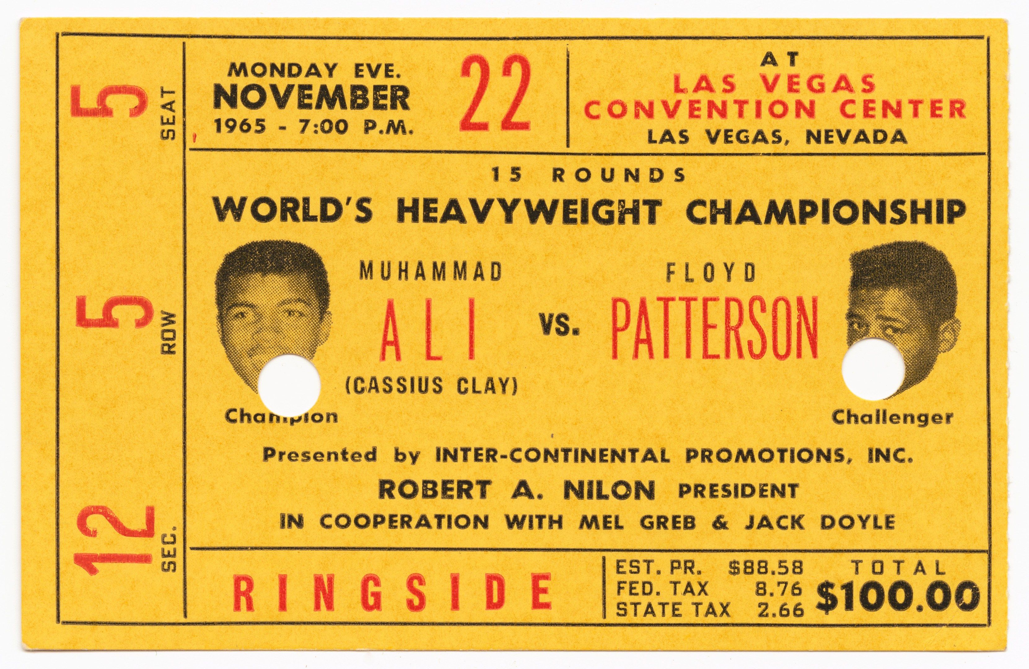 The image shows a yellow ticket for the World Heavyweight Championship featuring Muhammad Ali and...