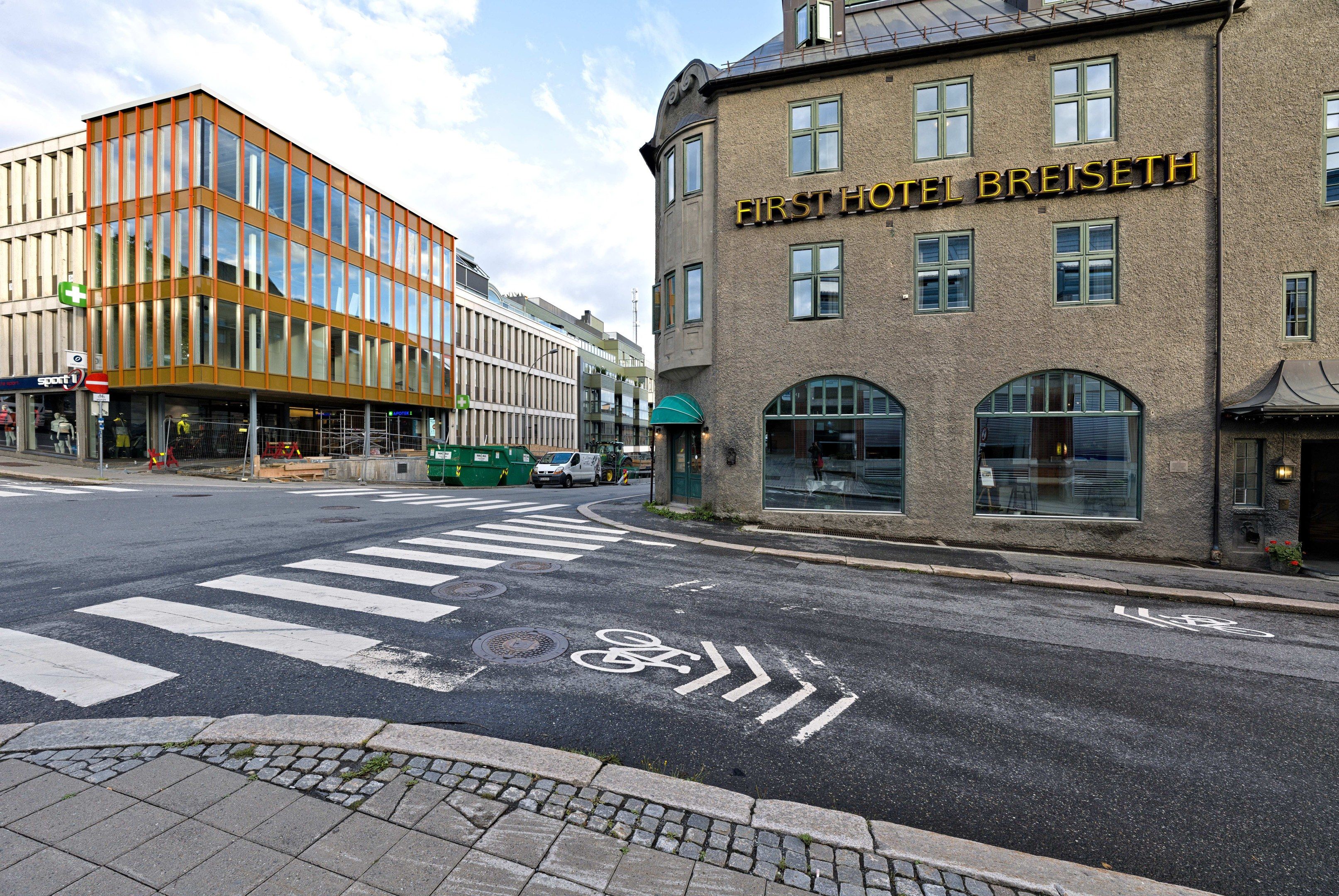 The image shows the first hotel breiseth in Berlin, Germany. It features buildings with windows,...
