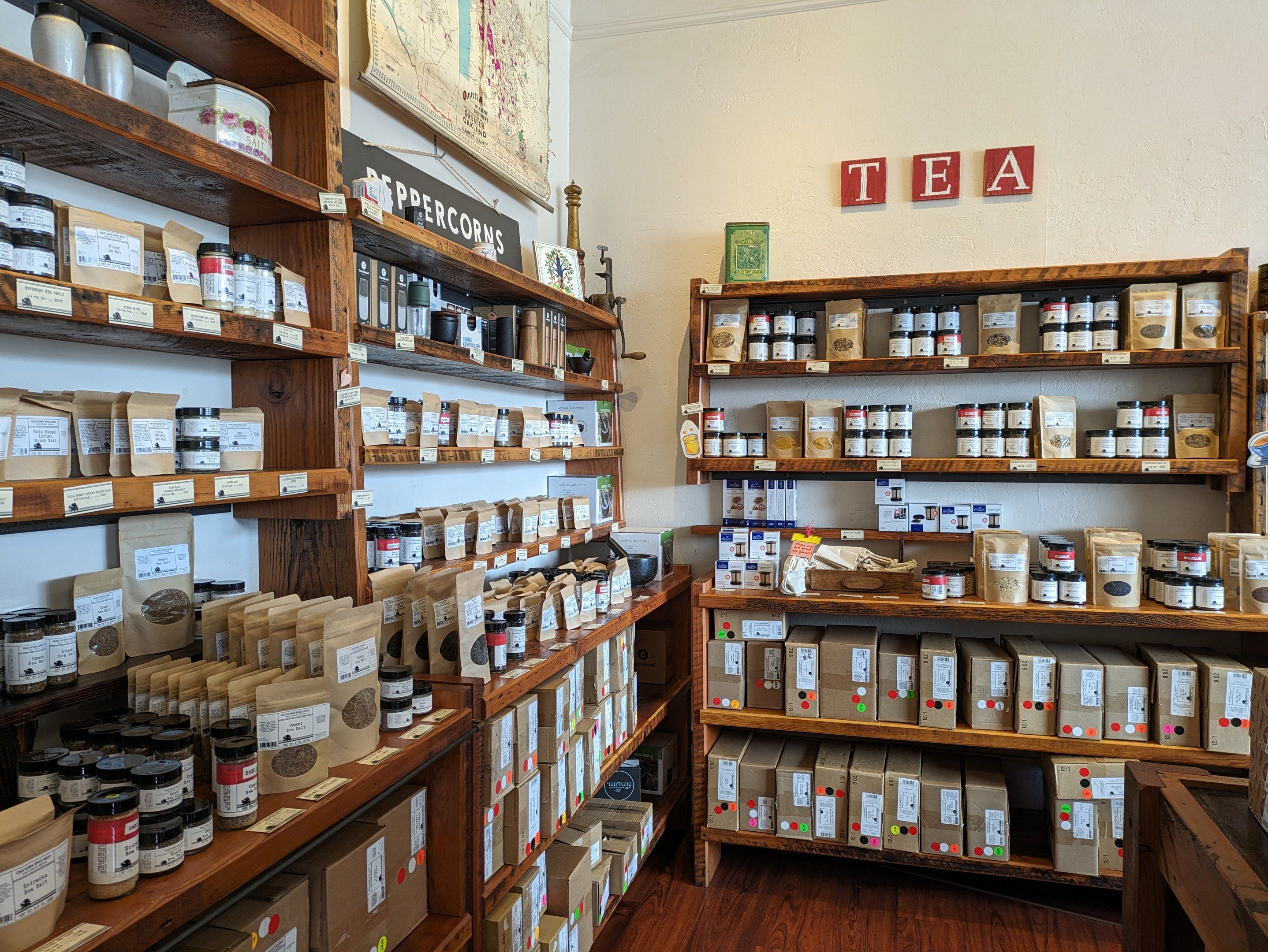 The image shows a room filled with lots of different types of food, including bottles, boxes, and...