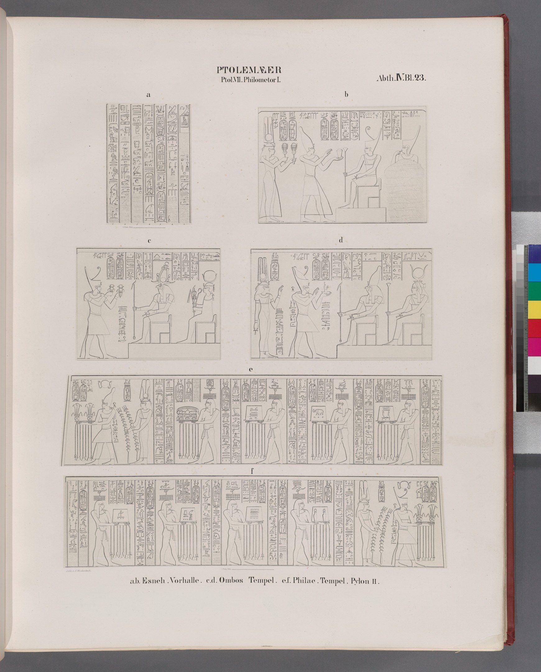 The image shows an open book with a drawing of Egyptian hieroglyphics on it, placed on a surface....