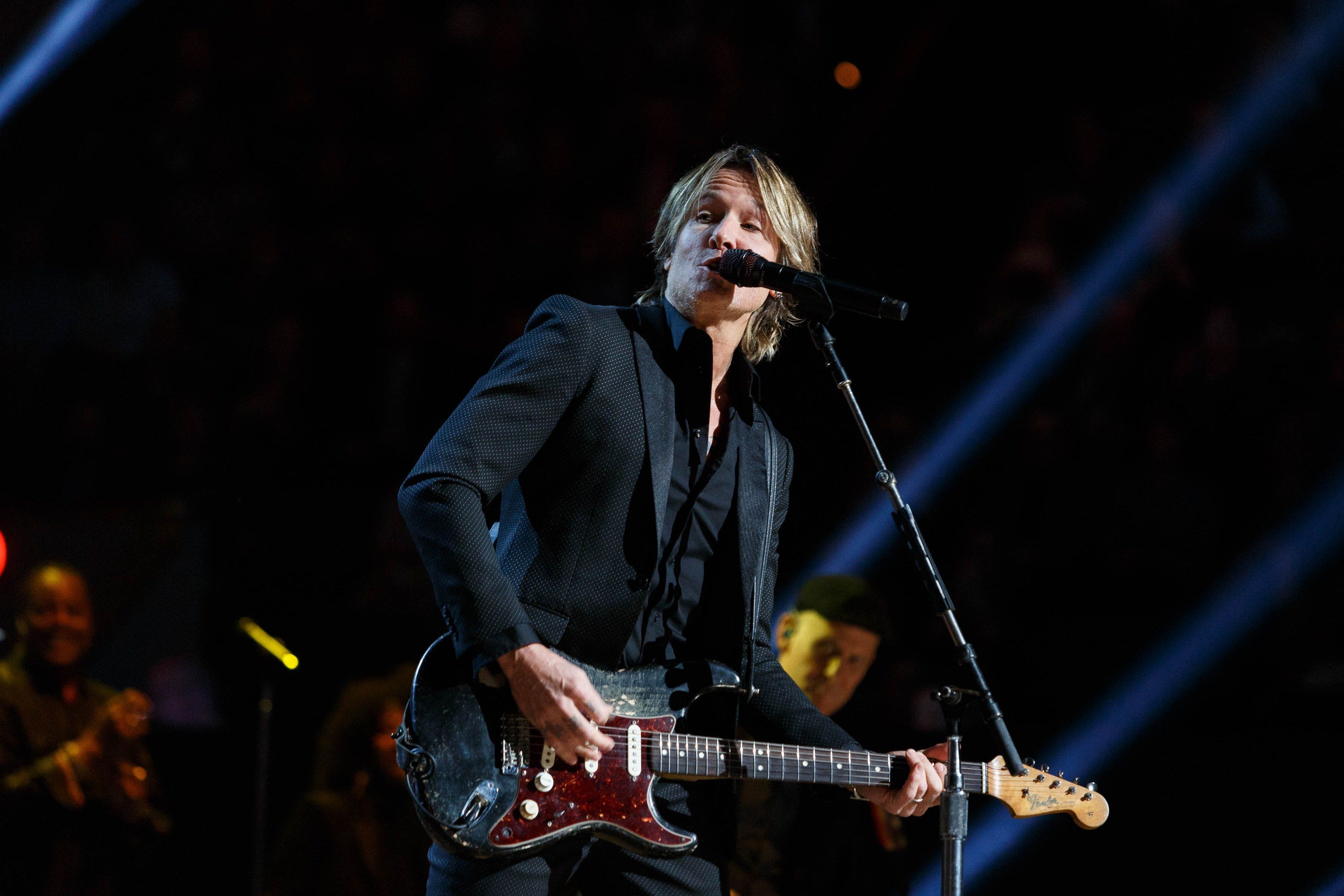 The image shows Keith Urban performing at the Joint at Hard Rock Hotel & Casino in Las Vegas. He is...
