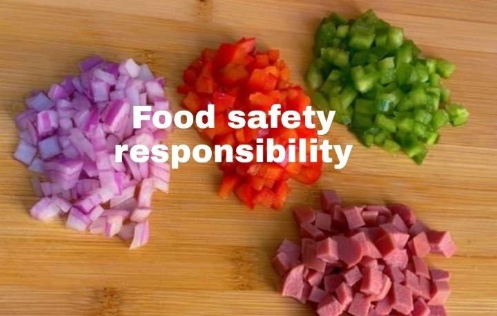 The image shows chopped vegetables on a wooden cutting board with the words "food safety...