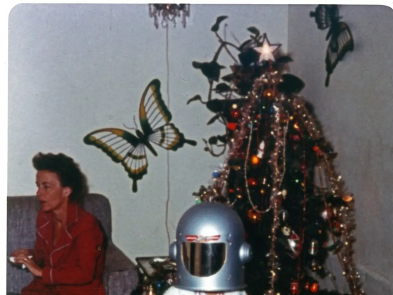 In the middle of this image, there is a child with a helmet and standing on a floor. Beside him,...