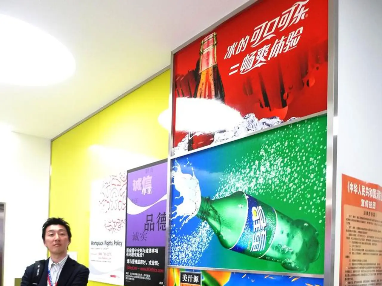 In this picture I can see there is a man standing and he is wearing a blazer and on to right there...