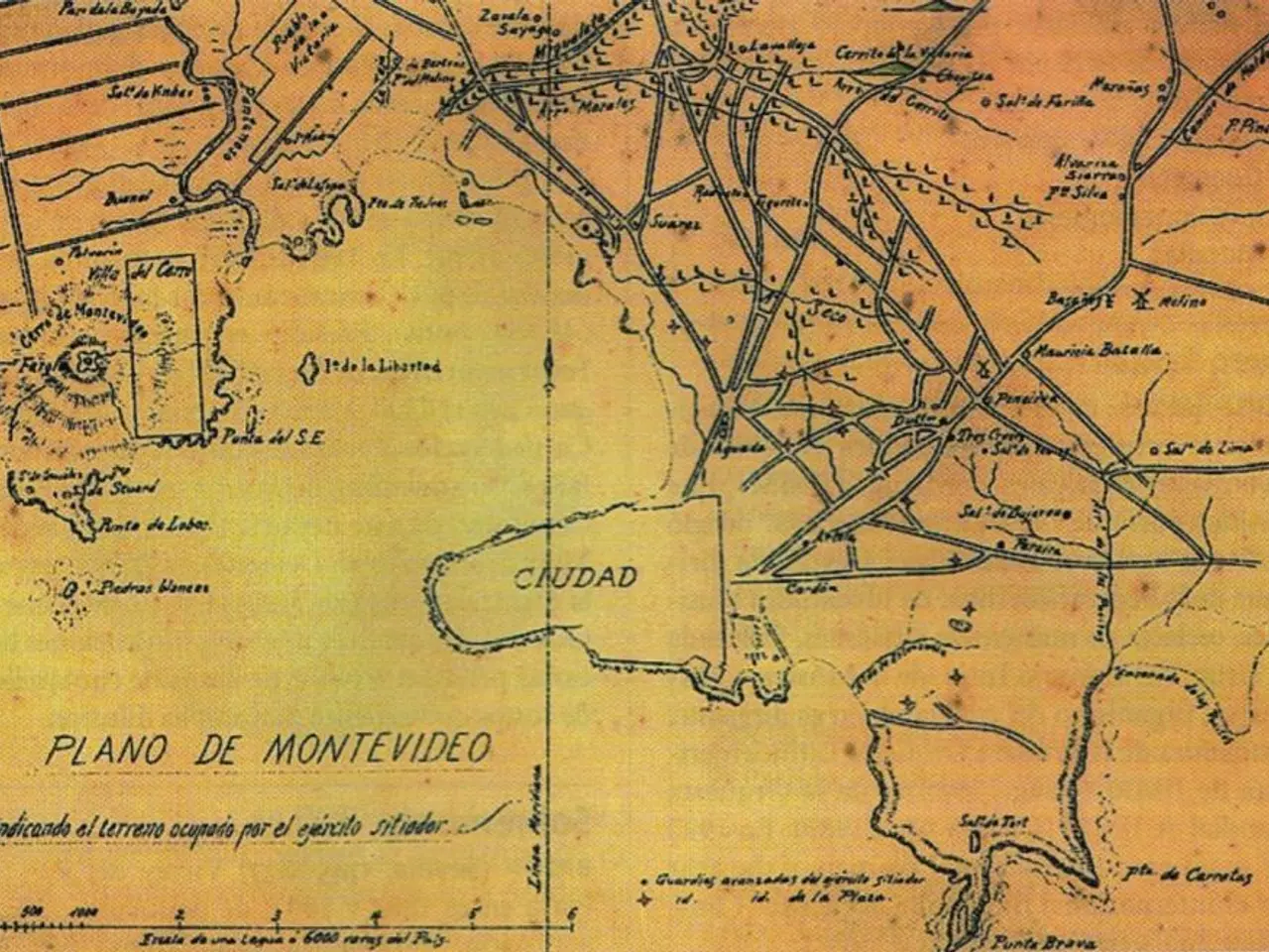 The image shows an old map of the city of Montevideo, Uruguay, with text written on it. The map is...