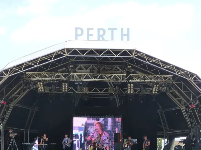 Band experiences flight delay turmoil; in response, members retrieve their musical instruments.