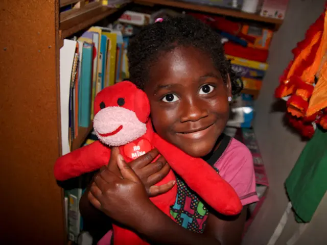 Hailey Bieber exhibitingly displays her toned physique in form-fitting black tank top and leggings,...