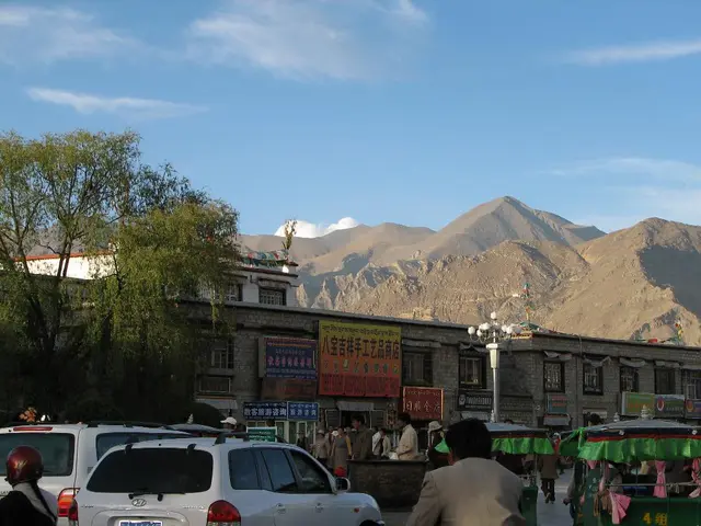 The summit of an Italian mountain offers stunning vistas of Lake Como and the Alps, accompanied by...