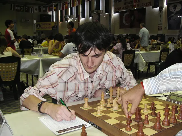 In this image we can see a man hand moving the chess coin on the chess board placed on the table....