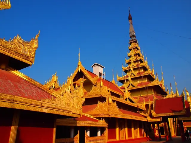This image is a picture of a Mandalay palace in Myanmar. At the top sky is visible.