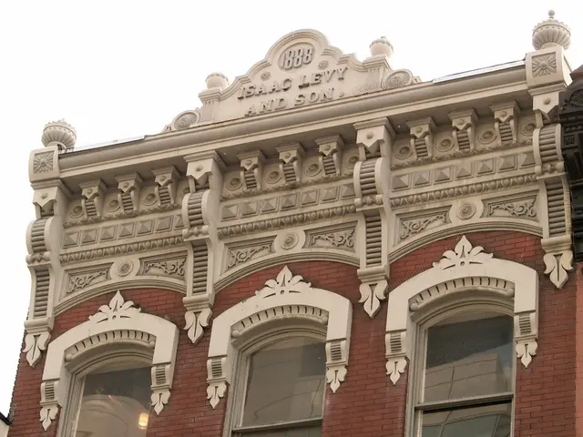 This is a building with the windows. I can see the design, which is carved on the wall. This looks...