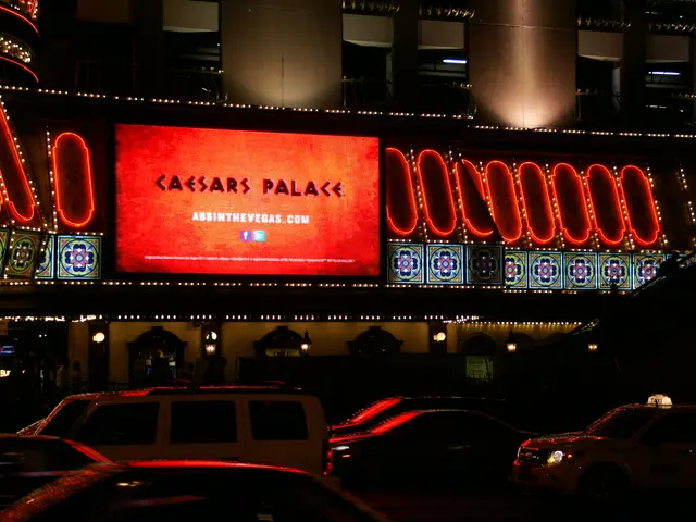 The image shows the Caesars Palace Hotel and Casino in Las Vegas, Nevada. There are vehicles on the...