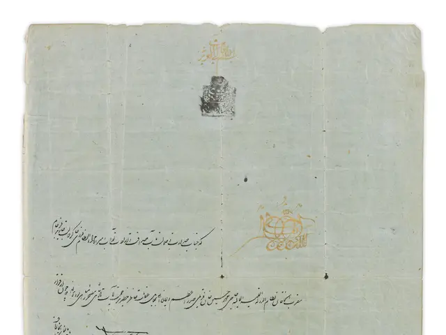 The image shows a piece of paper with Arabic writing on it, which appears to be a letter from the...