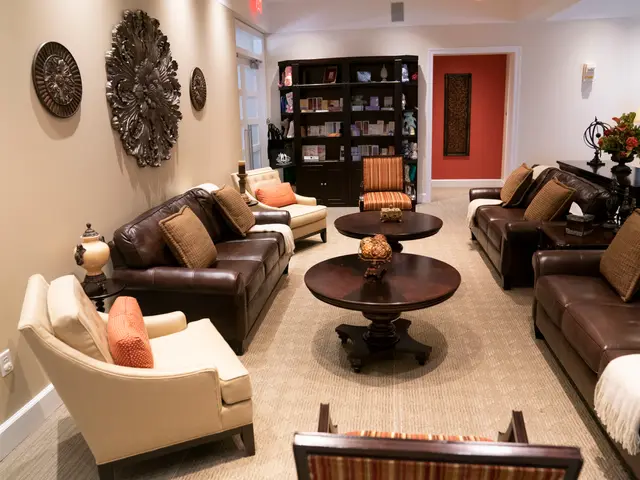 The image shows a living room filled with furniture such as sofas with cushions, chairs, tables,...