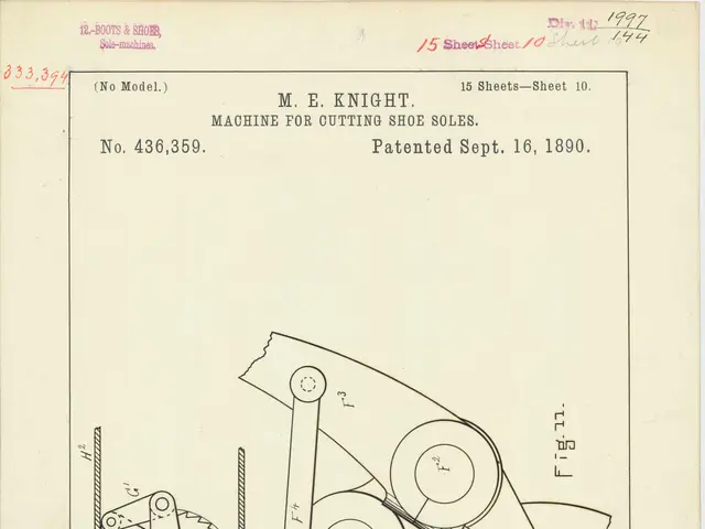 The image shows a drawing of a machine on a piece of paper with text written on it. The paper...