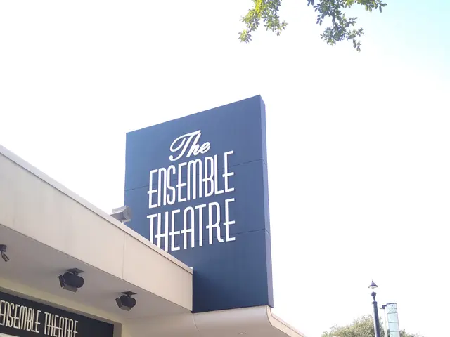 The image shows the Ensemble Theatre in San Francisco, California. It is a building with glass...