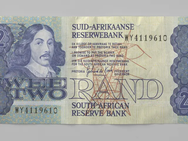 The image shows a South African two rand banknote with a picture of a man on it. The note has text...