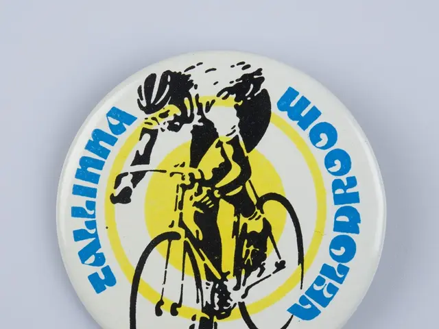 The image shows a white badge with a picture of a man riding a bicycle on it, with the words...