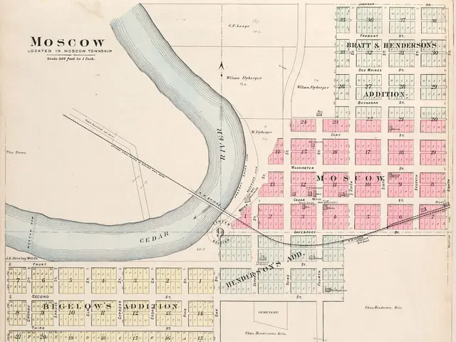 The image shows an old map of the city of Moscow, Russia, with a river running through it. The map...
