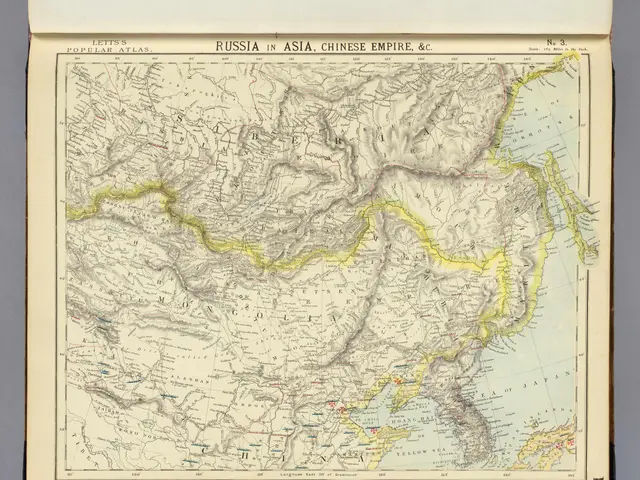 The image shows an old book with a map of Russia and China on it. The map is detailed and shows the...