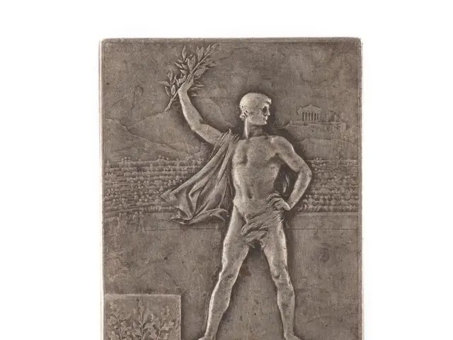 The image shows a silver plaque with a statue of a man holding a laurel wreath, which is likely a...