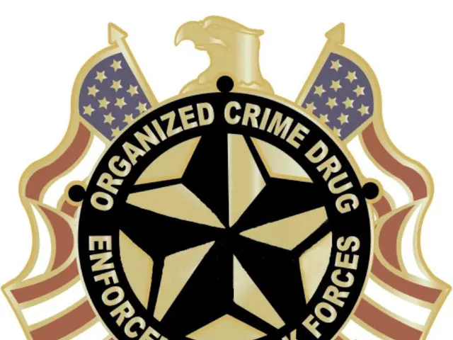 The image shows a logo with the text "Organized Crime Drug Enforcement Task Force" written on it,...