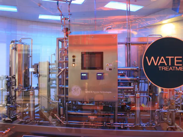 The image shows a large machine inside of a building with a sign that reads "Water Treatment" on...