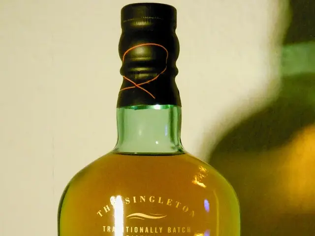 The image shows a bottle of Singleton of Dufftown Tailfire Single Malt Scotch Whisky placed on a...