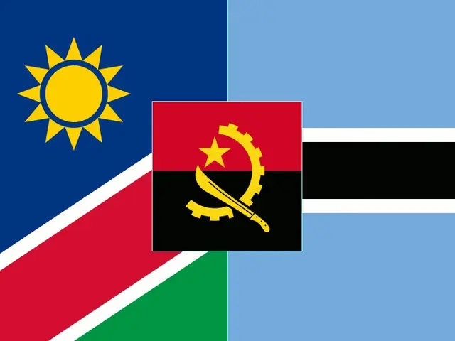 The image shows the flag of Namibia, which consists of a blue background with a yellow sun in the...