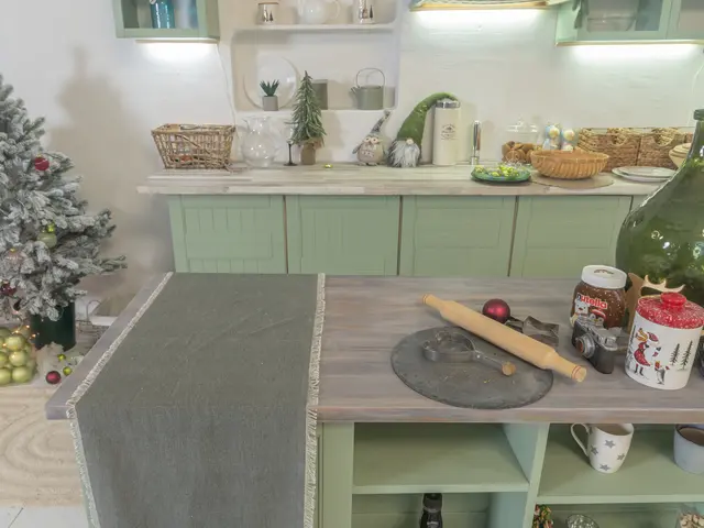 The image shows a kitchen with green cabinets and a Christmas tree in the corner. On the table...