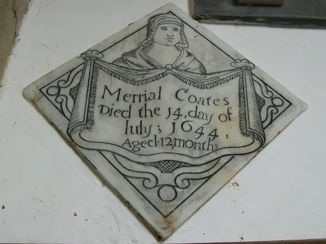 The image shows a plaque on the side of a building with a picture of a woman on it. The plaque is...