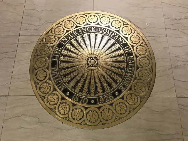 The image shows a gold plaque on the floor of a building, which reads "Mutual Life Insurance...
